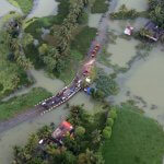 An aerial view shows partially submerged road at a flooded area in the southern state of Kerala